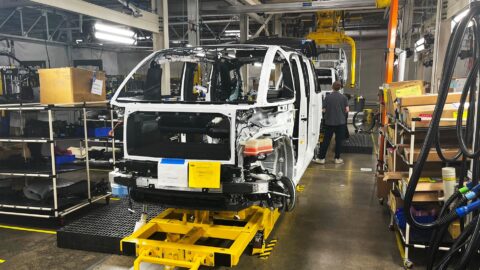 A Canoo moves down the assembly line.