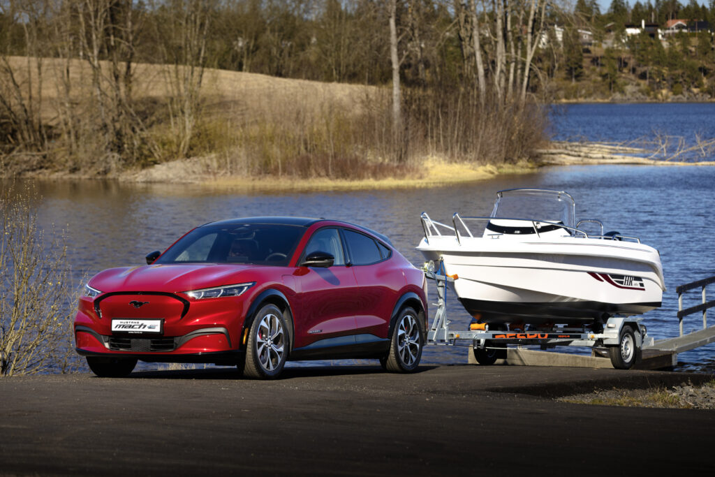 Ford Mustang Mach-E tows a boat